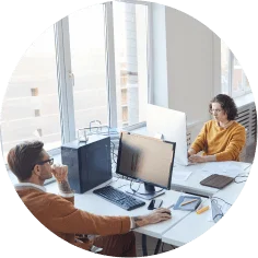 a man and woman sitting at a desk